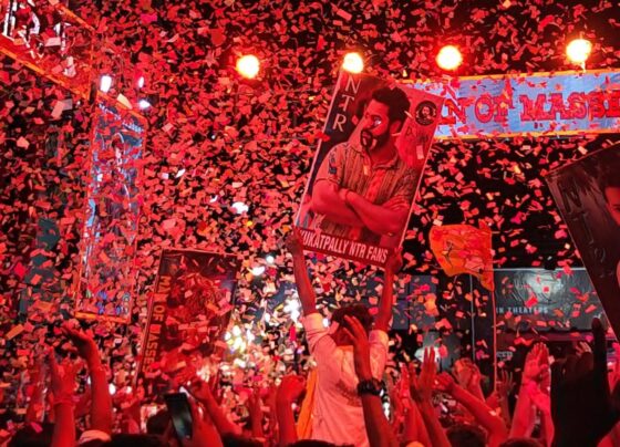 The much-anticipated movie "Devara: Part 1" has finally hit theaters, bringing the magic of director Koratala Siva and superstar NTR back to the big screen. This action-packed thriller, which marks Janhvi Kapoor's debut in Telugu cinema, promises a cinematic experience filled with intense performances, breathtaking visuals, and a gripping storyline. But does it live up to the hype? Let’s dive into this detailed review and explore the film's highlights. Star-Studded Cast and Crew "Devara: Part 1" boasts a stellar cast including NTR, Janhvi Kapoor, Saif Ali Khan, and many more renowned actors. The film is produced by Sudhakar Mikkilineni, Kosaraju Harikrishna, and Nandamuri Kalyan Ram. It features music by Anirudh Ravichander, cinematography by R. Rathnavelu, and editing by A. Sreekar Prasad. The movie was released on September 27, 2024, amidst great expectations. The Plot: A Tale of Power, Legacy, and Betrayal The story is set in the coastal region of Ratnagiri, where four villages collectively refer to the surrounding ocean as "Red Sea" due to its deep historical connections dating back to the British era. NTR plays a dual role in the film, portraying both Devara and his son Var. Devara and his long-time rival Bhair (played by Saif Ali Khan) control the illegal trade in the area, often involving the smuggling of weapons through the Red Sea. Devara, realizing the peril his actions bring to his people, decides to abandon the trade and focus on more sustainable ways of living, like fishing. However, Bhair refuses to relent, leading to an intense conflict between the two. Bhair’s ambition to dominate the sea brings forth a bloody war with Devara, while Var is tasked with seeking revenge and protecting their legacy. The plot is filled with dramatic twists and turns, as the two powerful men clash over control of the region and their conflicting values. At the heart of the story is Var’s quest to bring his father’s vision to life, aided by the charming Thangam (played by Janhvi Kapoor). Her role, although light-hearted, adds a fresh dynamic to the intense drama that unfolds. NTR’s Stellar Dual Role Performance NTR’s portrayal of Devara and Var is nothing short of extraordinary. His ability to seamlessly switch between these two complex characters showcases his range as an actor. As Devara, he is fierce, calculated, and deeply emotional, while as Var, he embodies youthfulness and determination. The raw power and vulnerability he brings to both roles elevates the film, keeping the audience captivated. Saif Ali Khan’s portrayal of the antagonist Bhair is equally impressive. His character exudes menace, and his scenes with NTR crackle with tension. The conflict between Devara and Bhair feels real and visceral, largely due to the powerful performances of both actors. Janhvi Kapoor’s Telugu Debut: A Promising Start Janhvi Kapoor’s role as Thangam provides some much-needed light moments in an otherwise intense film. Although her role does not carry the same weight as the male leads, she delivers a charming and believable performance. Her chemistry with NTR’s Var adds a romantic element to the story that helps balance the heavy action sequences. While her character could have been more fleshed out, her debut in Telugu cinema is a promising one, and fans are likely to see more of her in future installments. Visuals and Cinematography: A Feast for the Eyes One of the standout elements of "Devara" is its stunning visuals. Cinematographer R. Rathnavelu has expertly captured the grandeur of the sea and the rugged landscape, making the Red Sea itself feel like a character in the film. The action sequences set against the backdrop of the ocean are particularly breathtaking. The film’s production design also deserves praise, as it brings to life the rustic, coastal villages and the dangerous world of smuggling with remarkable detail. The visual effects, particularly in the battle scenes, are seamless and contribute to the film's epic feel. Music and Background Score: Enhancing the Drama Anirudh Ravichander’s music elevates the emotional beats of the film, especially during the action sequences and pivotal moments. The background score is intense and fitting, perfectly complementing the on-screen action. Songs like "Fear Song" and others are sure to leave a lasting impression on audiences, adding depth to the storytelling. Action and Pacing: Thrills That Keep You on the Edge From the opening scene, "Devara" plunges the audience into high-octane action. The fight sequences, particularly those involving NTR and Saif Ali Khan, are meticulously choreographed and packed with adrenaline. The mid-sea battles and hand-to-hand combat scenes are highlights, offering a unique and immersive experience for viewers. The first half of the film sets up the conflict between Devara and Bhair beautifully, while the second half introduces Var and Thangam, adding a new layer to the story. Although the film occasionally slows down, especially when focusing on Var’s journey, the momentum picks up again leading to a thrilling climax. Strengths and Weaknesses Strengths: NTR's Performance: His dual role portrayal is outstanding, particularly in scenes of emotional and physical intensity. Action Sequences: The film’s action scenes are expertly crafted and bring a fresh experience to audiences. Visuals: Cinematography and production design work together to create an immersive world. Weaknesses: Janhvi Kapoor’s Character: Her role feels underdeveloped, and her character could have been more integral to the plot. Pacing Issues: While the first half is engaging, the second half lags slightly before ramping up again for the finale. Conclusion: A Must-Watch for Action Lovers "Devara: Part 1" delivers on its promise of being an epic action thriller. With strong performances from NTR and Saif Ali Khan, breathtaking visuals, and a gripping storyline, the movie is a definite must-watch for fans of the genre. Although the film has a few minor flaws, they do not detract from the overall experience. The film leaves audiences eagerly awaiting the next installment to see how the story concludes. For those looking for a thrilling cinematic experience with powerful performances and stunning action, "Devara" is a movie that should not be missed.