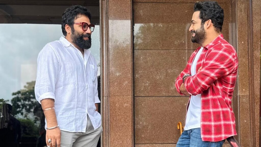 Jr NTR and Sandeep Reddy Vanga: Possible Collaboration Sparks Buzz in the Film Industry Jr NTR and Sandeep Reddy Vanga, two powerful names in Indian cinema, have fueled rumors of an exciting new project together after being spotted together recently. The viral image of the "Devara" star and the "Animal" director has led to wide speculation that the two may be collaborating on a future film, sending fans into a frenzy. This article delves into the details of their meeting, upcoming projects, and the buzz surrounding their possible partnership. Jr NTR Gears Up for "Devara" Release Telugu superstar Jr NTR is currently in the spotlight for his upcoming film "Devara." As the release of the highly anticipated trailer draws near, excitement is building among fans and movie enthusiasts alike. "Devara" marks Jr NTR’s first major release since the blockbuster hit "RRR," which brought him immense international recognition. Starring alongside Janhvi Kapoor and Saif Ali Khan, Jr NTR is poised to deliver another captivating performance in this action-packed film. The photo that has gone viral shows Jr NTR in a laid-back, casual outfit, wearing jeans paired with a grey t-shirt and a checkered shirt. His relaxed appearance reflects the casual nature of his meeting with Sandeep Reddy Vanga, further fueling curiosity about what the two discussed. Sandeep Reddy Vanga’s Growing Influence in Cinema Sandeep Reddy Vanga, best known for directing the blockbuster films "Arjun Reddy" and "Kabir Singh," continues to rise in stature in the film industry. After the success of these films, Vanga has now set his sights on his upcoming project, "Spirit," starring Prabhas. The director is also fresh off the release of "Animal," which stars Ranbir Kapoor and has garnered significant attention from audiences. The viral photo of Jr NTR and Sandeep together has sparked speculation about a potential collaboration between the two. Fans are eagerly hoping to see the dynamic combination of Jr NTR’s powerful acting and Vanga’s intense directorial style come to life on the big screen. The Viral Meeting: What Could This Mean? The buzz began when a source revealed to Pinkvilla that the duo met in Mumbai, sparking immediate rumors. “It was a casual meeting where the two discussed their craft, upcoming films, and the possibility of working together in the future. Both Vanga and NTR have a deep respect for each other’s work, and the idea of teaming up on something big and special is definitely on the table,” the source said. With Sandeep Reddy Vanga expressing his excitement for Jr NTR’s upcoming film "Devara," and Jr NTR showing interest in Vanga’s directorial projects, it seems only natural that a collaboration could be on the horizon. Fans are now keeping their eyes peeled for any official announcements regarding this much-anticipated pairing. Sandeep Reddy Vanga’s Upcoming Projects As Sandeep Reddy Vanga gears up for his upcoming project "Spirit," which stars Prabhas in the lead role, he remains one of the most sought-after directors in the Indian film industry. "Spirit" is expected to be a high-octane film that will showcase Vanga’s distinctive directorial style. In addition to "Spirit," Vanga has already teased a sequel to his latest hit "Animal." The announcement of "Animal Park," the next installment in the series, has left fans eagerly anticipating more details. With his hands full of exciting projects, it remains to be seen if Vanga will soon add a collaboration with Jr NTR to his busy schedule. Jr NTR’s Expanding Career: From "Devara" to "War 2" Beyond "Devara," Jr NTR’s career is on a remarkable upward trajectory. His next major project is "War 2," a film that has already garnered significant attention due to its stellar cast. Jr NTR will play a negative role in the film, marking his first time portraying a villain. The film also stars Bollywood heavyweight Hrithik Roshan, and rumors suggest that Kiara Advani will take on the female lead. This film is expected to be a game-changer for Jr NTR as he explores new dimensions of his acting range. With a line-up of blockbuster films like "Devara" and "War 2," Jr NTR is proving himself to be one of the most versatile actors in Indian cinema today. Fans are eagerly awaiting both films, and the potential collaboration with Sandeep Reddy Vanga could only add more excitement to his impressive slate of upcoming projects. Industry Buzz: Jr NTR and Sandeep Reddy Vanga’s Future Together While no official confirmation has been made about a project between Jr NTR and Sandeep Reddy Vanga, the film industry is buzzing with excitement over the possibility. Both stars have a track record of delivering highly successful films that leave a lasting impact on audiences. A collaboration between the two would likely result in a project of epic proportions, blending Jr NTR’s commanding screen presence with Vanga’s bold and unapologetic filmmaking style. Fans are eagerly awaiting any news regarding this potential team-up, and the viral photo has only added to the growing speculation. If the collaboration comes to fruition, it could be one of the most anticipated films in the Indian film industry. Conclusion: A Collaboration Worth Waiting For In the world of cinema, when two powerhouse talents like Jr NTR and Sandeep Reddy Vanga meet, sparks are bound to fly. While the viral photo has sparked rumors and fan theories, only time will tell if the duo will officially collaborate on a project. With both Jr NTR’s "Devara" and Sandeep Reddy Vanga’s "Spirit" releasing soon, fans have plenty to look forward to in the near future. One thing is certain: if these two decide to join forces, it will undoubtedly result in a film that will captivate audiences and make headlines across the industry. Fans and critics alike are keeping a close eye on what could be the next big collaboration in Indian cinema.