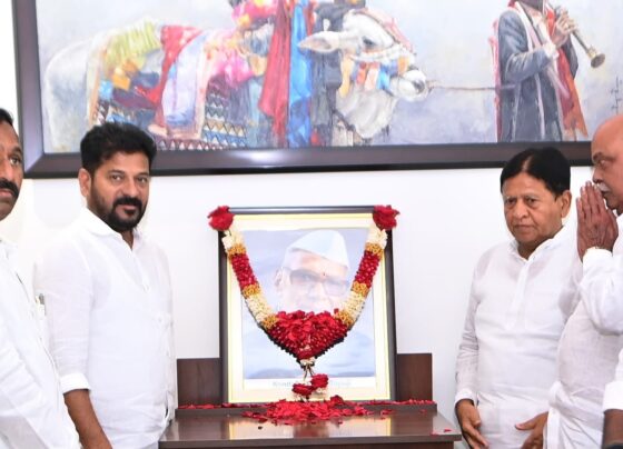 Revanth Reddy, Chief Minister of Telangana, paid glowing tributes to Konda Laxman Bapuji, a renowned freedom fighter and prominent Telangana activist, on the occasion of his death anniversary. The tribute took place at the CM's residence in Jubilee Hills, where Revanth Reddy, along with other Congress leaders, honored Bapuji by garlanding his portrait. Konda Laxman Bapuji: A Leader of the Masses Speaking on the occasion, CM Revanth Reddy praised Konda Laxman Bapuji as a great leader who dedicated his life to uplifting marginalized and underprivileged communities. He lauded Bapuji’s unyielding commitment to social justice and the betterment of weaker sections of society. The CM emphasized that Bapuji’s spirit would continue to guide the government’s efforts in serving the people. Honoring Konda Laxman Bapuji's Legacy In recognition of Bapuji's immense contributions, the Congress government had previously announced its decision to name the Indian Institute of Handloom Technology after Konda Laxman Bapuji. This gesture symbolizes the lasting impact of Bapuji’s work in promoting the welfare of artisans and handloom weavers, a cause he championed throughout his life. Official State Celebrations of Konda Laxman Bapuji's Birth Anniversary Further highlighting Bapuji's enduring legacy, the Telangana government has also decided to officially commemorate his birth anniversary on the 27th of this month. Chief Secretary Shanti Kumari issued orders to ensure that the celebrations take place across the state. These official events are expected to draw participation from all walks of life, paying homage to the leader who fought tirelessly for Telangana's cause. Padmashali Community Honors Bapuji In a related event, member