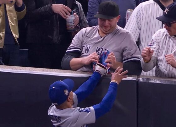 Attempted Fan Interference in the First Inning The game was still young when Yankees fans seated near the foul pole in right field decided to take matters into their own hands. With the Dodgers already leading 2-0 in the bottom of the first inning, Yankees batter Gleyber Torres launched a high fly ball toward the right-field foul line. Betts, racing to make the play, reached the edge of the stands just as the ball descended. As Betts reached up to make the catch, the fans leaned over the railing and attempted to interfere. One fan reached for Betts’ glove, appearing to tug at it in an attempt to force a drop, while another fan tried to push his arm away. Despite these efforts, the Dodgers’ star held onto the ball long enough for the play to be ruled an out. Umpire crew chief Mark Carlson, stationed nearby, quickly called fan interference, awarding the out to Betts. Security Steps In, Fans Escorted Out of Stadium Security personnel at Yankee Stadium wasted no time addressing the situation. Moments after the interference call, stadium security approached the fans involved and escorted them from their seats. Video footage captured the pair being led away from the field and into the concourse area, indicating their likely ejection from the game. Fan interference has been a sensitive issue in professional baseball, particularly in high-stakes games like the World Series. Incidents involving fans attempting to alter the outcome of plays can lead to serious consequences, both for the individuals involved and for the integrity of the game. In this case, the Yankees fans’ actions briefly disrupted the game and earned a quick response from both the umpires and stadium security. Mookie Betts’ Reaction to the Interference Attempt Betts, who successfully prevented the interference from costing his team an out, didn’t hide his frustration. After securing the catch, he shot a frustrated glance at the crowd, visibly displeased by the fans’ attempt to interfere with his play. Betts returned to his position in the outfield, but the incident set the tone for an intense game. As the game resumed, Betts continued to play with focus, undeterred by the fans’ interference attempt. The Dodgers went on to complete the inning, maintaining their lead while the Yankees worked to close the gap. High Stakes for Yankees Fans and World Series Tensions With the Yankees trailing the Dodgers in the World Series, fans at Yankee Stadium were eager to see their team mount a comeback. For some fans, this intensity may have led them to take drastic measures, like the interference attempt on Betts’ play. In the heat of competition, even the most dedicated fans sometimes lose sight of the boundaries, and this incident serves as a reminder of the importance of respecting the players and the game. Consequences and Reactions The fan interference in Game 4 not only disrupted the play but also stirred conversations about the responsibilities of fans in high-stakes environments like the World Series. While fan enthusiasm is part of the excitement of live sports, actions that cross the line can lead to consequences. The ejection of these fans serves as a warning to others that unsportsmanlike conduct is not tolerated. Following the incident, opinions among fans and commentators were mixed. Some felt that the interference showed poor sportsmanship, while others argued it was a momentary lapse in judgment fueled by passion for the game. Nevertheless, the incident raised questions about whether additional measures should be taken to ensure fan behavior remains respectful and within the bounds of the game. Impact on the Yankees’ World Series Hopes Ultimately, the interference call did not significantly alter the course of Game 4, but it underscored the intensity of the rivalry between the Yankees and Dodgers. The Yankees, trailing in the World Series, continued their fight but failed to capitalize on key opportunities in the game. Two runners on base in the first inning, following the interference, ultimately could not bring in any runs, as back-to-back groundouts halted their advance. As the series progresses, both teams and their fans are likely to be under increased scrutiny. The interference incident serves as a reminder that while fan passion is integral to the sport, respect for the game and the players is paramount. Conclusion: A Lesson in Sportsmanship The attempted interference by Yankees fans in Game 4 of the World Series highlights the importance of maintaining respect for players and the game. While fans bring energy and excitement to baseball, crossing the line can impact the flow of the game and reflect poorly on teams and their supporters. This incident is a reminder to fans everywhere: cheer passionately but respect the boundaries of the game.