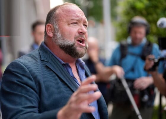 The Onion Secures Infowars in Bankruptcy Sale, Transforming Alex Jones's Site into Satire The popular satirical news outlet, The Onion, recently made headlines by winning the bid to acquire Infowars, the infamous platform led by conspiracy theorist Alex Jones. This purchase, made through a bankruptcy auction, has garnered attention as The Onion plans to turn Infowars into a parody of its former self. However, shortly after the deal was announced, the bankruptcy court intervened, placing a temporary hold on the transaction. A hearing is scheduled for next week to address the sale. Backed by Sandy Hook Families: A Symbolic Acquisition The Onion’s bid was not only a business move but also an act of solidarity with the families affected by the Sandy Hook Elementary School tragedy. In 2022, these families won a historic $1.4 billion defamation lawsuit against Alex Jones for his claims that the massacre was a hoax. Their backing of The Onion’s bid demonstrates support for using satire to challenge harmful conspiracy theories. Ben Collins, CEO of The Onion’s parent company Global Tetrahedron, expressed the company’s intention to relaunch Infowars as a platform that will mock the misinformation industry and highlight the absurdities behind various conspiracy theories. Collins shared in an interview that this acquisition will allow The Onion to bring humor to a domain typically known for promoting divisive and unproven ideas. “The families saw this as a powerful prank,” Collins noted, explaining that they believe it’s essential to counteract harmful narratives through humor and satire. In January, Infowars is expected to be reintroduced with a satirical twist, poking fun at internet personalities who capitalize on misinformation and endorse dubious health products. Infowars’ Shift from Conspiracy to Comedy The winning bid marks a striking transformation for Infowars, which has, for years, been a prominent platform for conspiracy theories and misinformation. Known for promoting alternative narratives and controversial viewpoints, Alex Jones built Infowars into a hub for those skeptical of mainstream media. Under The Onion’s direction, Infowars will turn from a promoter of conspiracy to a humorous takedown of conspiracy culture. The relaunch will target figures like Jones himself, as well as others who exploit audiences for financial gain by promoting unverified and sensational claims. Jones, however, has already voiced his concerns. Lawyers representing Jones and an affiliated company that offered $3.5 million for the website have challenged the validity of the auction process. This has led the court to question the bidding and hold a hearing to determine the outcome. What the Acquisition Includes The Onion’s winning bid encompasses all major assets related to Infowars, including its website, social media accounts, Austin, Texas-based studio, trademarks, video archive, and more. Almost immediately following the announcement, Infowars went offline, and Jones began broadcasting from a new location. If the acquisition proceeds, The Onion will own Infowars’ digital presence, providing the satirical publication with a platform to deliver its signature humor to a new audience. The Onion views this purchase as part of a broader mission to hold alternative media and internet influencers accountable for spreading misinformation. Collins emphasized that Infowars’ new direction will go beyond just Jones, targeting other figures in the misinformation landscape. “There’s a whole world of podcasters and social media influencers spreading questionable narratives,” Collins said, acknowledging the immense followings many of these personalities have built. Satire with a Purpose: Holding Alternative Media Accountable