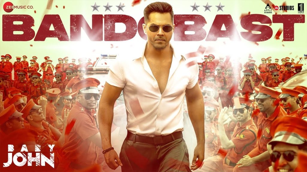 Bandobast Song Review: An Energetic Fusion of Beats and Lyrics The song Bandobast, performed by Varun Dhawan and featuring the musical talents of Thaman S, Mame Khan, and lyricist Irshad Kamil, is a powerhouse of energy and rhythm. Released as part of a high-octane project, the track encapsulates the essence of celebration and camaraderie. In this article, we will explore the song’s highlights, delve into its lyrical nuances, and understand its appeal to listeners. An Overview of Bandobast Bandobast opens with a lively beat that sets the tone for the entire track. The rhythm is infectious, instantly drawing the listener into a world of vibrant energy. Varun Dhawan's electrifying performance is complemented by the dynamic composition of Thaman S, making it a song that resonates with a diverse audience. The track blends traditional and modern elements, with a sprinkle of folk influences brought to life by the soulful voice of Mame Khan. Irshad Kamil’s lyrics add depth to the music, creating a perfect balance between melody and meaning. Lyrical Depth and Meaning The lyrics of Bandobast celebrate themes of unity, courage, and the joy of living life to the fullest. Lines like: “Seedhe saade hain apne iraade” emphasize the straightforward intentions and sincerity of the protagonist. The song also carries a motivational undertone, encouraging listeners to overcome challenges with a fearless attitude: “Rowdy ke bheje mein de goli, Acchon se khelenge hum holi.” This metaphorical line implies that bold actions and fearless choices define true strength and resolve. Musical Composition and Style Thaman S’s composition for Bandobast is a vibrant mix of dhol beats, electronic elements, and traditional instrumentation. The track's upbeat tempo, combined with its energetic percussion, creates an atmosphere perfect for dancing or festive celebrations. The interplay between the rhythmic beats and Mame Khan’s folk-inspired vocals adds a unique texture to the song. This dynamic combination keeps the listeners engaged, making the song memorable and replay-worthy. Varun Dhawan's Impactful Performance Varun Dhawan’s charismatic screen presence brings an added dimension to Bandobast. His high-energy choreography and expressive performance amplify the song's celebratory vibe. Known for his versatility, Varun captures the song's essence with enthusiasm, ensuring that the audience remains captivated throughout. Audience Reception and Cultural Significance Since its release, Bandobast has struck a chord with listeners across the globe. Its universal themes and captivating beats make it an ideal addition to any party playlist. The song’s ability to combine modern production with traditional influences highlights the evolving nature of contemporary Indian music. Moreover, the collaborative effort of talented artists like Thaman S, Mame Khan, and Irshad Kamil ensures that the song appeals to both the younger generation and fans of classic folk music.