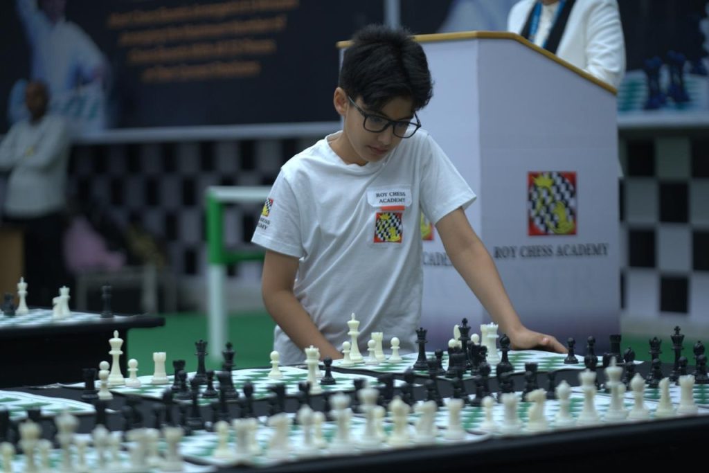 Nara Devansh, the grandson of Andhra Pradesh Chief Minister Nara Chandrababu Naidu and the son of Minister Nara Lokesh, has made history in the world of chess. His incredible accomplishment has earned him recognition from the prestigious World Book of Records, London, highlighting his exceptional skills and dedication to the game. In this article, we will delve into the inspiring journey of Nara Devansh, his extraordinary achievements, and the significance of his contributions to the chess community. World Record Achievement in Chess Nara Devansh created a world record by becoming the "Fastest Checkmate Solver," solving an impressive 175 puzzles in rapid succession. This outstanding feat has been officially certified by the World Book of Records, London. The organization awarded a certificate to Devansh, recognizing his remarkable skill and focus. The certificate details his accomplishment, stating that he solved 175 checkmate puzzles from the renowned chess book 5334 Problems and Games by László Polgár in just 11 minutes and 59 seconds on December 18, 2024. Additional Milestones: Beyond Chess Puzzles Devansh didn’t stop at solving puzzles. He went on to set two more world records that showcase his versatility and mastery in chess: Arranging Nine Chessboards in Five Minutes Devansh arranged nine chessboards in a record-breaking five minutes, placing all 32 pieces accurately and swiftly in their correct positions. This achievement highlights his sharp memory, precision, and speed. Tower of Hanoi Challenge Displaying his problem-solving prowess, Devansh completed the challenging 7-disc Tower of Hanoi in just 1 minute and 43 seconds. This accomplishment demonstrates his ability to think strategically under pressure. A Proud Moment for the Nara Family The Nara family has expressed immense pride in Devansh’s achievements. Minister Nara Lokesh shared his excitement and praised his son’s dedication to chess. “Devaansh has embraced chess with great enthusiasm and worked diligently for weeks to achieve this milestone,” Lokesh stated. He also extended heartfelt gratitude to the Roy Chess Academy and Devansh’s coach, K. Rajashekar Reddy, for their guidance and support in shaping Devansh’s skills. Behind the Success: Training and Dedication Devansh’s success is a testament to his hard work and commitment to the game. He reportedly trained for 5-6 hours daily, demonstrating an unparalleled level of focus and perseverance. His coach, K. Rajashekar Reddy, described him as a “dynamic and dedicated student,” applauding his determination and quick learning abilities. The representatives of the World Book of Records were equally impressed by Devansh’s skills and precision, further validating the magnitude of his achievements. The Influence of Historic Chess Events Nara Devansh’s passion for chess stems from his admiration for the historic events and legendary players in the game. Inspired by their achievements, he has made his mark as a young chess prodigy. His ability to solve complex puzzles and execute rapid chess moves has earned him a well-deserved place among the finest in the chess world. A Bright Future Ahead With his record-breaking accomplishments at such a young age, Nara Devansh has become a source of inspiration for aspiring chess players. His journey underscores the importance of hard work, discipline, and a love for the game. As the chess community celebrates his achievements, Devansh’s story serves as a powerful reminder that passion and perseverance can lead to extraordinary success. Nara Devansh’s achievements not only bring pride to his family but also put Andhra Pradesh on the global chess map. With continued dedication and support, this young prodigy is poised to achieve even greater milestones in the future.