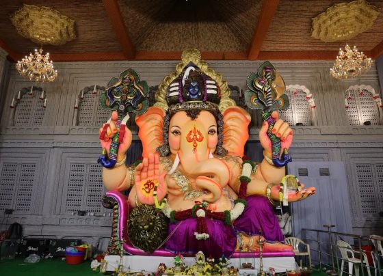 The majestic spectacle of Balapur Ganesh Utsav 2025 promises to be an extraordinary spiritual experience that transcends the boundaries of devotion and artistry. This year's celebration has captured national attention with its breathtaking theme – a meticulously crafted replica of the renowned Swarnagiri Venkateswara Swamy temple near Yadadri. As someone who has witnessed countless Ganesh celebrations across India over the past decade, I can confidently say that Balapur's 2025 mandap represents a pinnacle of cultural heritage and artistic excellence that will leave an indelible mark on every visitor's heart. What makes this year's celebration truly special isn't just the architectural grandeur, but the profound spiritual symbolism embedded in every detail. The Balapur Ganesh festival has evolved from a humble community gathering in 1994 to become one of India's most celebrated religious events, attracting millions of devotees from across the globe. The transformation from a modest ₹450 laddu auction to the record-breaking ₹30.01 lakh bid in 2024 tells a remarkable story of faith, community spirit, and divine blessings. The Magnificent Swarnagiri Temple Replica: Where Divine Architecture Meets Devotion Walking into the Balapur mandap this year feels like stepping into a sacred realm where earthly craftsmanship mirrors celestial beauty. The Swarnagiri Venkateswara Swamy temple replica stands as a testament to the extraordinary skills of artisans from Shamirpet and Dilsukhnagar, who dedicated over a month of continuous work to bring this vision to life. Kellam Niranjan Reddy, president of the Balapur Ganesh Utsav Samithi, explains that the intricate Jala Narayana Swamy installation mirrors the original temple's design with remarkable precision. The original Swarnagiri temple, located on the picturesque Manepally Hills just 47.3 kilometers from Hyderabad, represents a magnificent fusion of architectural styles from the Pallava, Vijayanagara, Chola, and Chalukya dynasties. This ₹500 crore architectural marvel, built over seven years on a sprawling 22-acre property, houses Telangana's largest Venkateswara Swamy idol at 12 feet tall. The Balapur artisans have captured this grandeur through innovative fiber work, creating a mandap that showcases four Rajagopurams leading to spacious halls and a five-story Vimana Gopuram above the sanctum sanctorum. What struck me most during my recent visit was the attention to detail in recreating the temple's signature elements. The fiber construction allows for intricate carvings and decorative elements that would be impossible with traditional materials, while maintaining the structural integrity needed to accommodate thousands of daily visitors. The lighting system, carefully designed to illuminate the mandap during evening hours, creates an almost ethereal atmosphere that transforms the entire space into a divine sanctuary. Behind the Scenes: The Artistry and Dedication That Defines Excellence The creation of this magnificent replica represents one of the most ambitious undertakings in recent Hyderabad Ganesh pandal history. Despite challenging weather conditions, including the heavy rains that have characterized this monsoon season, the construction team worked tirelessly to complete the project. The commitment shown by these artisans reflects the deep spiritual connection that drives the entire Balapur community. Sudhakar Reddy, who leads the team of artisans responsible for the Swarnagiri replica, brings decades of experience in temple architecture and festival decoration. His team's expertise in fiber work allows them to create structures that are both visually stunning and practically sound. The fiber temple setup technique they've pioneered enables the creation of intricate architectural details while ensuring the mandap can withstand the physical demands of hosting hundreds of thousands of visitors over the 10-day festival period. The construction process began with detailed study of the original Swarnagiri temple's architectural plans and photographic documentation. Every element, from the smallest decorative motif to the grandest architectural feature, was carefully measured and replicated. The team worked in shifts, maintaining progress even during the heaviest downpours that have marked this year's monsoon season. This dedication to authenticity extends beyond mere visual similarity. The artisans have incorporated traditional construction techniques wherever possible, using modern materials like fiber only where they enhance durability and safety. The result is a structure that honors the original temple's spiritual essence while meeting the practical requirements of a major public festival. Sacred Iconography: The Divine Presence of Multiple Deities The spiritual significance of this year's Balapur celebration extends far beyond its architectural magnificence. The mandap houses not only the traditional 21-foot Ganesh idol seated regally on a diwan but also includes representations of Anantha Padmanabha Swamy and Venkateswara Swamy. This unique combination creates a powerful spiritual atmosphere that resonates with devotees from diverse Hindu traditions. The inclusion of Anantha Padmanabha Swamy, the form of Lord Vishnu reclining on the serpent Adi Sesha, adds profound theological depth to the celebration. This deity, particularly revered in Kerala's Padmanabhaswamy Temple, represents the eternal, infinite nature of divine consciousness. The careful placement of this idol alongside Lord Ganesha creates a spiritual dialogue between different aspects of Hindu devotional practice. Above the main Ganesh idol, artisans have placed the face of Lord Shiva, symbolizing the unity of the Hindu trinity and the interconnected nature of divine energy. This innovative design element transforms the traditional Ganesh celebration into a comprehensive spiritual experience that acknowledges the full spectrum of Hindu theological understanding. The floral decoration Ganesh Chaturthi elements throughout the mandap include traditional toranas made from fresh flowers, with particular emphasis on marigolds, roses, and jasmine that are considered especially sacred to Lord Ganesha. These decorations are refreshed daily by dedicated volunteers, ensuring that the visual and aromatic experience remains vibrant throughout the festival period. The Legendary Balapur Laddu Auction: A Tradition of Faith and Fortune No discussion of Balapur Ganesh Utsav would be complete without examining the extraordinary tradition of the laddu auction, which has become a cultural phenomenon extending far beyond Hyderabad's boundaries. The journey from ₹450 in 1994 to ₹30.01 lakh in 2024 represents more than mere inflation – it reflects the growing faith in the transformative power of this sacred prasadam. The story begins with Kolan Mohan Reddy, a humble farmer who made the first successful bid in 1994. According to local legend, after winning the auction, Mohan Reddy distributed portions of the laddu to his family and then sprinkled the remaining prasadam on his farmland. The subsequent bumper harvest convinced the community that the Balapur laddu possessed extraordinary spiritual power, establishing a tradition that continues to this day. The 2024 auction, won by Kolan Shankar Reddy for ₹30.01 lakh, demonstrates the enduring appeal of this tradition. The 21 kg Balapur laddu, prepared with pure ghee, milk instead of water, and enriched with premium dry fruits, represents the pinnacle of devotional offering. The auction process itself has evolved into a carefully orchestrated event, with participants required to deposit the previous year's winning amount in advance to qualify for bidding. The September 6, 2025 auction promises to be particularly significant, with Chief Minister A Revanth Reddy invited to attend the ceremony. This high-level political participation reflects the auction's evolution from a local community event to a matter of state-wide importance. The proceeds from the auction continue to fund community development projects, including temple renovations, CCTV installations, educational initiatives, and infrastructure improvements throughout the Balapur area. Crowd Management and Safety: Ensuring Divine Experiences for All The massive popularity of Balapur Ganesh festival necessitates sophisticated crowd management strategies that balance accessibility with safety. The organizers have implemented comprehensive measures including strategic barricading, multiple entry and exit points, and coordination with local police forces to ensure smooth movement of the hundreds of thousands of expected visitors. The Ganesh Chaturthi Hyderabad events require special attention to weather-related challenges this year, as the IMD has issued warnings for continued rainfall throughout the festival period. Heavy rains have already begun affecting the city, with Hyderabad receiving significant precipitation on the festival's opening day. These conditions require additional safety measures, including covered walkways, non-slip flooring materials, and enhanced drainage systems around the mandap. Police guidelines for 2025 emphasize several critical safety protocols. Organizers must deploy volunteers with proper identification cards around the clock to manage queues and assist with security checks. Emergency equipment, including fire safety apparatus, sand bags, and water drums, must be readily available at all times. The mandap is equipped with CCTV cameras providing comprehensive coverage and real-time monitoring capabilities. Visitors should plan their trips carefully, considering both weather conditions and crowd patterns. Morning visits typically offer better safety conditions for families with children, while evening visits provide the full impact of the mandap's lighting design. The organizers recommend avoiding peak hours (typically 6-10 PM) unless visitors are prepared for extended waiting periods and crowded conditions. Community Spirit and Cultural Heritage: The Heart of Celebration The true magic of Balapur Ganesh Utsav lies not in its spectacular visual elements but in the extraordinary community participation that makes the festival possible. Youth volunteers from across Hyderabad contribute thousands of hours of service, managing everything from crowd control to decoration maintenance. Senior citizens share their decades of festival experience, ensuring that traditional practices are preserved while embracing innovative improvements. The cultural heritage mandap themes have evolved over the years to reflect contemporary spiritual interests while maintaining connection to classical Hindu traditions. Previous themes have included the Ayodhya Ram Mandir (2024), Vijayawada Kanaka Durga Temple (2023), and Yadadri temple designs. Each year's theme selection involves extensive community consultation and careful consideration of both artistic possibilities and spiritual significance. Women play crucial roles in the festival's success, particularly in the preparation of traditional offerings and the maintenance of ritual purity throughout the celebration period. The preparation of modaks, the sweet offering traditionally associated with Lord Ganesha, becomes a community-wide activity involving families across the Balapur area. These traditional sweets are prepared using recipes passed down through generations, maintaining authentic flavors and spiritual significance. The involvement of artisan communities from across Telangana creates economic opportunities that extend far beyond the festival period. The skills developed for Ganesh mandap construction are later applied to wedding decorations, corporate events, and other cultural celebrations, creating year-round employment for specialized craftspeople. Weather Considerations and Visitor Guidelines for 2025 The 2025 Ganesh Chaturthi celebrations coincide with an active monsoon period that requires careful planning from both organizers and visitors. The India Meteorological Department has issued yellow alerts for Hyderabad and surrounding districts, predicting continued rainfall through early September. These conditions create both challenges and opportunities for festival participants. The rain adds a mystical quality to the celebration, with the sound of droplets on the mandap's tarpaulin roof creating a natural percussion accompaniment to devotional chanting. However, visitors must take appropriate precautions including waterproof footwear, umbrellas, and protective covering for electronic devices. The organizers have installed additional lighting to compensate for reduced natural illumination during overcast conditions. Transportation to and from the festival site may be affected by waterlogged roads and increased traffic congestion. Visitors should allow extra travel time and consider using public transportation where possible. The TGSRTC has deployed additional buses and maintenance personnel to handle increased demand and potential weather-related breakdowns. Safety considerations become particularly important during wet conditions. The mandap's flooring has been treated with anti-slip materials, and additional handrails have been installed at key points. Visitors are advised to move slowly and carefully, particularly in areas where large crowds gather for darshan. Looking Beyond 2025: The Future of Balapur Ganesh Celebrations The success of this year's Swarnagiri temple replica sets new standards for future celebrations and demonstrates the community's commitment to continuous innovation within traditional frameworks. The techniques developed for fiber construction will likely influence pandal design across India, offering new possibilities for creating elaborate temporary structures that rival permanent architecture in their visual impact. The environmental implications of using fiber instead of traditional materials deserve consideration as the festival industry grapples with sustainability concerns. While fiber construction reduces the need for large quantities of wood and other natural materials, it raises questions about long-term disposal and recycling. The Balapur organizers are exploring partnerships with manufacturing companies to repurpose mandap materials for commercial applications after the festival. The growing recognition of Balapur Ganesh as a national cultural symbol opens possibilities for international participation and cultural exchange programs. Several overseas Indian communities have expressed interest in creating scaled replicas of Balapur's designs for their own celebrations, potentially spreading Telangana's cultural influence to global Indian diaspora communities. The integration of technology, including drone photography for promotional materials and digital payment systems for donation collection, points toward a future where traditional celebrations embrace modern conveniences while preserving their essential spiritual character. The committee is exploring virtual reality applications that could allow remote participation for devotees unable to visit in person. Conclusion: A Celebration That Transforms Hearts and Communities The Balapur Ganesh Utsav 2025 represents far more than a religious festival – it embodies the transformative power of collective devotion, artistic excellence, and community solidarity. The magnificent Swarnagiri temple replica serves as a bridge between earthly craftsmanship and divine inspiration, creating sacred space where millions of hearts unite in celebration of Lord Ganesha's benevolent presence. As we witness the continued evolution of this remarkable tradition, from its humble beginnings with a ₹450 laddu auction to today's spectacular architectural achievements, we see reflected the very qualities that Lord Ganesha represents: the removal of obstacles, the blessing of new beginnings, and the triumph of wisdom over ignorance. The dedication of countless volunteers, the skill of master artisans, and the unwavering faith of devotees combine to create an experience that transcends the boundaries between sacred and secular, traditional and innovative. Whether you come seeking spiritual solace, artistic inspiration, or simply the joy of participating in one of India's grandest celebrations, the Balapur Ganesh Utsav offers a transformative experience that will resonate long after the final immersion ceremony. In the words whispered by countless devotees as they depart: "Ganapati Bappa Morya, Pudhchya Varshi Lavkar Ya" – may Lord Ganesha return next year with even greater blessings for all who seek his divine grace. Frequently Asked Questions Q: What are the visiting hours for Balapur Ganesh Utsav 2025? The mandap remains open 24/7 throughout the festival period (August 27 - September 6, 2025) for free darshan. However, for the best experience with manageable crowds, visit during morning hours (6 AM - 10 AM) or late evening (after 10 PM). The lighting effects are particularly spectacular after sunset, making evening visits ideal for photography enthusiasts. Q: How can I participate in the famous laddu auction on September 6, 2025? To participate in the Balapur laddu auction, you must register in advance by paying a deposit equal to the previous year's winning amount (₹30.01 lakh for 2025). Registration requires submission of identification documents and the deposit must be paid in cash or bank transfer one day before the auction. The auction begins around 10 AM on September 6, following the morning procession through Balapur village. Q: What safety precautions should visitors take given the current weather conditions? With heavy rains predicted throughout the festival period, visitors should wear waterproof footwear, carry umbrellas, and dress in quick-dry clothing. The mandap has anti-slip flooring and adequate drainage, but extra caution is advised in crowded areas. Avoid touching electrical installations and stay away from temporary structures during lightning. Keep electronic devices in waterproof covers and allow extra travel time due to potential traffic delays from waterlogged roads