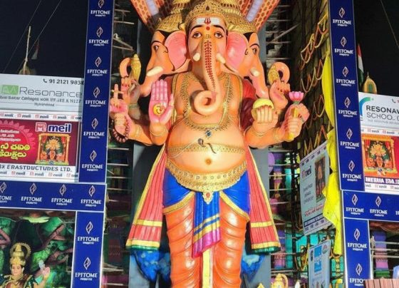 Khairatabad Ganesh 2025: Puja Timings, Aagaman Date, Laddu Auction & Travel Guide Hey there, folks! As someone who's been covering festivals in Hyderabad for over a decade now, I've seen the Khairatabad Ganesh celebrations grow from a local favorite into this massive, city-wide spectacle that draws millions. Picture this: back in 2015, I was dodging crowds to get a glimpse of the idol, which was "only" about 60 feet tall then. Fast forward to today, and the 2025 edition has me buzzing with excitement all over again. The Khairatabad Ganesh 2025 idol stands at an impressive 69 feet, themed as Sri Viswa Shanti Mahashakti Ganapathi, symbolizing world peace and power. It's not just bigger; it's a reminder of how traditions evolve while staying rooted in devotion. If you've ever felt that electric vibe during Ganesh Chaturthi in Hyderabad, you know what I mean— the chants, the lights, the sheer energy. In this guide, I'll walk you through everything you need for Khairatabad Ganesh 2025: from puja timings and the aagaman date to laddu auction details, travel tips, parking hacks, darshan passes, and even eco-friendly highlights. Whether you're a local or visiting from afar, I've got personal tips from my years of navigating these crowds to make your experience smooth and memorable. Khairatabad Ganesh 2025 Highlights Let me start by painting a picture of what makes Khairatabad Ganesh 2025 stand out. This year, the idol is 69 feet tall, crafted meticulously over 84 days by around 125 artisans under the guidance of chief sculptor Chinnaswamy Rajendran, who's been involved since 1978. The theme, Vishwashanti Mahashakti Ganapati, embodies peace and strength, which feels especially relevant in our fast-paced world. I remember one year when the theme was about environmental harmony, and it sparked conversations among devotees— this one's got that same thoughtful vibe. The aagaman, or arrival and unveiling, happened on August 26, 2025, with grand celebrations that lit up the streets. The festival kicked off on August 27 with the first pooja, and it's running through September 6 for the visarjan. Daily darshan starts early, around 6 AM, and goes late into the night, with special homams and rituals sprinkled throughout. From my experience, the second day—like today, August 28—often includes a homam starting around noon, complete with vibrant decorations and maybe even a VIP visit. I've seen crowds swell by mid-morning, so if you're planning a visit, aim for those quieter slots. One personal insight: the idol's face reveal is always a highlight; this year, with its eco-friendly clay and natural colors, it looks more majestic than ever under the lights. Khairatabad Ganesh 2025 Laddu Distribution & Auction Ah, the laddu—where would Ganesh festivals be without it? The Khairatabad Ganesh laddu has a rich history, starting as a simple offering and evolving into a massive auction event that raises funds for charity. In past years, we've seen laddus weighing up to 25,000 kg, auctioned off for crores. For Khairatabad Ganesh 2025, while exact details are still unfolding, expect a giant laddu around that scale, made with pure ghee, nuts, and devotion. The auction typically happens on the last day before visarjan, around September 5 or 6, drawing bidders from across the state. I once bid on a smaller version during a mini-auction (didn't win, but the thrill was real!), and it's not just about the sweet—it's symbolic of prosperity. Distribution starts daily after poojas, with prasadam given to devotees. On day two, for instance, they've been handing out laddus and other treats non-stop from afternoon onward. Pro tip from my decade of festival hopping: get there post-noon for fresh batches, but wear comfy shoes because the lines can snake around the pandal. This year's event might see record bids, given the buzz, so if you're into philanthropy, keep an eye on local news for auction timings. Travel & Accommodation for Devotees Planning a trip to Khairatabad Ganesh 2025? Trust me, as someone who's lugged camera gear through Hyderabad's traffic for years, preparation is key. If you're coming from out of town, fly into Rajiv Gandhi International Airport and hop on a cab or metro to the city center—it's about 30 km away. For locals or those in Telangana, trains to Hyderabad Deccan or buses via TSRTC are reliable and affordable. Stay-wise, budget options like OYO rooms or lodges near Khairatabad start at around ₹1,500 per night, while premium spots like Taj Deccan or Novotel offer luxury from ₹5,000 upward, with views of the city lights. I've stayed at a mid-range hotel near Hussain Sagar once, and waking up to the festival hum was unbeatable. Book early—rates spike during Chaturthi. For connectivity, the metro's a lifesaver: alight at Khairatabad station, just a short walk to the pandal. Buses from Secunderabad or Charminar are frequent too. One example from my travels: during the 2018 festival, I used the metro to beat a massive jam, arriving in time for the evening aarti. If you're driving, carpool to cut costs and hassle. Parking & Traffic Management Traffic during Ganesh Chaturthi? It's like a game of Tetris, but with horns. For Khairatabad Ganesh 2025, Hyderabad police have rolled out advisories starting August 29 through September 5, with diversions based on crowd flow, especially near NTR Marg and Necklace Road. Avoid four-wheelers if you can; opt for bikes or public transport. Designated parking includes spots behind IMAX near the Ambedkar statue—perfect for quick access. From my experience, parking at Yousufguda or metro lots and walking saves hours. The commissioner himself visited today to review setups, emphasizing CCTV, drones, and joint control centers for safety. Expect moderate congestion, so follow barricades and volunteers. A tip I swear by: use apps like Google Maps for real-time updates, but add 30 minutes buffer. Last year, I parked at a suggested zone and zipped in via a side route—game-changer. Darshan, Pooja, and Shobha Yatra Details Darshan at Khairatabad is pure magic, but timing it right is crucial. Puja timings run daily from 6 AM, with maha harati at 9 PM— that's when the lights dim, and the energy peaks, giving you goosebumps every time. For the 10 days, expect special rituals like homam on day two, and rudraksha mala offerings. Special darshan passes for VIPs are available via organizers, but for general folks, queues form early. The Shobha Yatra on September 6 is the grand finale: a colorful procession to Hussain Sagar for immersion, starting from the pandal and winding through streets with music and dances. I've marched in a few, and the route via Tank Bund is chaotic but exhilarating. Personal insight: if you have kids or elders, go for early morning darshan—there's a "secret" back entry from 6-8:30 AM where crowds are thin, and you can even touch the idol's feet. No passes needed, just show up! Eco-Friendly Initiatives & Idol Theme 2025 Sustainability is big this year, and I'm all for it after seeing pollution post-visarjan in earlier festivals. The Khairatabad Ganesh 2025 idol uses eco-friendly clay from Gujarat, rice husk, and natural dyes—no harmful chemicals. Local NGOs and GHMC are pushing awareness campaigns for green celebrations, like using biodegradable materials for decorations. The theme ties in perfectly, promoting peace through eco-conscious practices. In my 10 years, I've noticed a shift: more devotees opting for clay idols at home, inspired by Khairatabad. Example: one year, I joined a workshop on making eco-ganesh, and it changed how I celebrate. Organizers are also distributing saplings—grab one! Tips for a Safe & Comfortable Visit Safety first, always. Best times? Early mornings or late evenings to dodge peak crowds—avoid noon if you hate heat. Carry water, ID, comfy footwear, and a mask for dust. For visarjan, stay back from the water's edge; I've seen slips happen. With heavy footfall expected, follow police guidelines on electrical safety and overcrowding. My go-to: pack snacks, but enjoy the prasadam stalls. If pregnant or with seniors, use the back entry I mentioned. And hey, capture memories, but respect no-photo zones inside. How to Stay Updated on Khairatabad Ganesh 2025 In this digital age, staying looped in is easy. Follow official Instagram like @khairatabadganesh_official for live updates. Local portals like Sakshi Post, Tupaki English, or Eenadu have real-time coverage. Join WhatsApp groups or Telegram channels for traffic alerts—I've used them to reroute mid-journey. Police handles like @CPHydCity post advisories too. One example: during 2020's muted festivities, social media kept the spirit alive virtually. Wrapping up, Khairatabad Ganesh 2025 is shaping up to be epic with its towering idol, heartfelt rituals, and community vibes. From puja timings to the laddu auction and travel hacks, you've got all you need for an unforgettable visit. Don't wait—plan now to soak in the devotion without the stress. Bookmark this page for the latest on Khairatabad Ganesh 2025, and share your stories in the comments. Jai Ganesh!