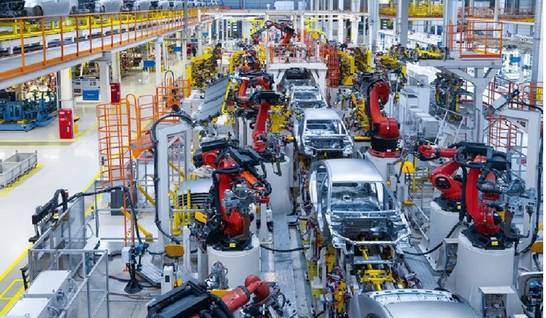 Samvardhana Motherson Q1 2026 Results: Navigating Growth Amid Industry Transformation Samvardhana Motherson International Limited (formerly Motherson Sumi Systems) delivered a mixed Q1 FY2026 performance that exemplifies the broader challenges facing the global automotive supply industry. While the company achieved revenue growth of 4.7% year-over-year to ₹30,212 crores, net profit declined dramatically by approximately 49% to ₹512 crores, highlighting the margin compression pressures affecting automotive suppliers worldwide. This performance underscores the complex dynamics of an industry undergoing fundamental transformation while grappling with stagnant volumes, geopolitical uncertainties, and the costly transition to electric mobility. Samvardhana Motherson Financial Performance: Revenue Growth vs Profit Decline in Q1 FY2026 Financial Performance Analysis Revenue Growth Amid Market Headwinds Samvardhana Motherson's Q1 FY2026 revenue of ₹30,212 crores represented a modest 4.7% year-over-year growth, surpassing the previous year's Q1 figure of ₹28,868 crores. This growth occurred against a backdrop of challenging global automotive market conditions, where production volumes remained largely stagnant across major markets. The revenue increase was primarily driven by higher passenger vehicle production in India and China, along with contributions from the company's integrated assemblies, vision systems, and emerging business divisions, including recent acquisitions such as Atsumitec. The company's diversified business portfolio across five key segments—Wiring Harness, Vision Systems, Modules & Polymer Products, Integrated Assemblies, and Emerging Businesses—provided resilience during this challenging period. The Modules & Polymer Products division, which encompasses the largest business line within Motherson, continued to demonstrate steady performance despite margin pressures in this segment. Significant Profit Decline and Margin Compression The most concerning aspect of Motherson's Q1 results was the substantial decline in profitability. Net profit dropped from ₹994 crores in Q1 FY2025 to ₹512 crores in Q1 FY2026, representing a 48.5% year-over-year decrease. This dramatic profit erosion was accompanied by a compression in EBITDA margins from 9.6% to 8.1%, reflecting the broader industry trend of deteriorating profitability. The company's profit margin fell from 3.80% in the previous year to 2.88% in Q1 FY2026, indicating significant operational pressure. This margin compression aligns with global industry patterns, where automotive suppliers are experiencing average EBIT margins of just 4.7% in 2024, down from 5.3% in 2023. The decline reflects multiple factors including inflation in raw materials, higher energy costs, increased labor expenses, and the substantial capital investments required for electric vehicle transition. An automotive wiring harness with protective sleeving and connectors displayed against a white background Industry Context and Global Challenges The Era of "Stagformation" in Automotive Supply The automotive supplier industry globally is experiencing what industry experts term "stagformation"—a combination of stagnant volume growth and the urgent need for fundamental business model transformation. This phenomenon has resulted in structural challenges that extend far beyond Motherson's individual performance. Global automotive suppliers are facing an average profit margin of just 4.7% in 2024, marking a continued decline from pre-COVID levels that were typically 2 percentage points higher. Regional variations in supplier performance reveal interesting patterns. Chinese suppliers lead with EBIT margins of 5.7%, while European suppliers lag at 3.6% and South Korean suppliers at 3.4%. North American suppliers, while performing better than their European counterparts, still face significant pressure from stagnant production volumes and slower-than-expected electric vehicle adoption. Supply Chain Disruptions and Geopolitical Tensions The automotive industry continues to grapple with supply chain vulnerabilities that emerged during the COVID-19 pandemic and have been exacerbated by geopolitical tensions. Trade wars between the United States, China, Mexico, and Canada are disrupting global automotive supply chain ecosystems, creating uncertainty for companies like Motherson that operate across 43 countries with over 400 facilities. The ongoing conflict in Ukraine, tensions in Eastern Europe and the South China Sea, and escalating trade disputes have created a complex web of challenges for automotive suppliers. These geopolitical factors are forcing companies to reconsider their supply chain strategies, potentially leading to nearshoring and reshoring initiatives that could fundamentally reshape the industry's global footprint. Robotic assembly line in a modern automotive factory illustrating advanced manufacturing automation Electric Vehicle Transition and Strategic Investments EV Business Growth and Future Potential Despite current margin pressures, Motherson's electric vehicle business segment shows promising growth trajectories. The company's EV revenue currently contributes about 4% to its total revenue, but this segment experienced 50% year-over-year growth in recent quarters. The content value in EV programs is significantly higher than traditional internal combustion engine models, with EV wiring harnesses typically generating 1.5 times more revenue per vehicle. Motherson's three new greenfield projects are expected to contribute approximately 20% growth, with these facilities specifically designed to serve the expanding electric vehicle market. The company's order book includes a significant proportion of pure electric vehicle programs, which jumped to 25% by the end of FY2021, indicating strong future potential. Greenfield Investments and Capacity Expansion The company's strategic investment in greenfield projects represents a calculated bet on the future of automotive electrification. These new facilities are designed to manufacture high-voltage wire harnesses and advanced EV components, positioning Motherson to capitalize on the growing demand for electric vehicle systems. However, these investments are currently weighing on short-term profitability as the company incurs startup costs and operates below optimal utilization rates during the ramp-up phase. The ramp-up of greenfield operations is expected to begin more meaningfully in the second half of FY2026, potentially providing significant growth momentum. This strategic patience reflects the company's long-term orientation and confidence in the electric vehicle transition, despite the current margin pressures. Schematic diagrams comparing electrical systems of an electric vehicle and traditional vehicle components Global Market Position and Competitive Landscape Ranking Among Global Automotive Suppliers Samvardhana Motherson holds the 31st position among global automotive suppliers by revenue, with approximately €8.755 billion in automotive-related sales as of 2021. This positions the company as a significant player in the global automotive supply ecosystem, competing with industry giants such as Bosch (ranked 1st), Denso (2nd), Continental AG (3rd), and ZF Friedrichshafen (4th). The company's global footprint spans 43 countries with over 400 facilities and employs more than 190,000 professionals worldwide. This extensive international presence provides both advantages in terms of market access and customer proximity, as well as challenges related to managing diverse regulatory environments and geopolitical risks. Customer Diversification and Market Exposure Motherson serves nearly all major automotive original equipment manufacturers (OEMs) globally, with Daimler Group, Audi, and Volkswagen accounting for approximately 35% of revenues. This customer diversification provides some protection against individual OEM-specific challenges, though it also exposes the company to broader industry cyclicality. The company's revenue distribution shows significant global exposure, with nearly 90% of revenues generated outside India. Approximately half of revenues come from Germany, France, Spain, and the United States, reflecting the company's strong presence in developed automotive markets. Exterior mirror of Audi Q5 NF with glare reduction and camera features by Motherson, produced in China Sector-Specific Performance and Business Segments Wiring Harness Division Leadership The Wiring Harness division represents one of Motherson's core strengths and most vertically integrated business units. Through its subsidiary Motherson Sumi Wiring India Limited (MSWIL), the company maintains over 40% market share in the Indian wiring harness industry. This division benefits from increasing content per vehicle trends, as modern vehicles require more sophisticated electrical systems to support advanced features and electronic components. The division's performance is particularly relevant in the context of electric vehicle adoption, where wiring harnesses become even more critical due to high-voltage systems and increased electrical complexity. The company's expertise in this area positions it well for the ongoing automotive electrification trend. Vision Systems and Mirror Technology Motherson's Vision Systems division, operating through Samvardhana Motherson Reflectec (SMR), represents one of the leading global suppliers of rearview vision systems. This division manufactures interior mirrors, exterior mirrors, and camera-based detection systems for almost all major automotive OEMs worldwide. The vision systems business benefits from increasing vehicle safety regulations and the growing adoption of advanced driver assistance systems (ADAS). As vehicles become more sophisticated and autonomous driving technologies advance, the demand for advanced vision systems is expected to grow significantly. Modules and Polymer Products Diversification The Modules and Polymer Products division encompasses the largest business line within Motherson, developing and producing a highly diversified product range from simple plastic parts to highly integrated systems and modules. This division operates 129 facilities across 26 countries and generated ₹499,118 million in revenue with an EBITDA margin of 8.6% for fiscal year 2024. This division's broad product portfolio includes interior components such as instrument panels, door panels, and center consoles, as well as exterior products including bumpers, front-end modules, and spoilers. The diversification within this segment provides resilience against specific product line challenges while capturing value across the entire vehicle. Industry Outlook and Future Growth Drivers Indian Automotive Market Expansion The Indian automotive market presents significant growth opportunities for Motherson, with the sector expected to reach USD 300 billion by 2026. The passenger vehicle segment alone is projected to grow at a compound annual growth rate (CAGR) of over 9% between 2022-2027, reaching USD 54.84 billion by 2027. This domestic growth provides a strong foundation for the company's operations. The Indian automotive component sector, which contributes 2.3% to GDP and employs 1.5 million people directly, grew at a CAGR of 8.63% from FY2016-FY2024. Exports reached USD 21.2 billion in FY2024 and are projected to reach USD 30 billion by 2026, indicating strong international demand for Indian automotive components. Global Automotive Components Market Dynamics The global automotive components market, valued at approximately USD 1.9 trillion in 2025, is projected to reach USD 2.78 trillion by 2033, growing at a CAGR of 4.89%. This growth is driven by increasing vehicle production, rising demand for electric vehicles, and growing content per vehicle as automotive technology advances. Regional market dynamics show varying growth patterns, with Asia Pacific markets, particularly China and India, driving the most significant volume growth. The Chinese automotive components market is expected to grow from USD 264 billion in 2021 to USD 517 billion by 2033, representing substantial opportunity for suppliers with Chinese operations. Electric Vehicle Market Acceleration The global electric vehicle market presents perhaps the most significant long-term growth opportunity for automotive suppliers. The EV market in India is expected to grow at a CAGR of 49% between 2022-2030, while the global EV market is projected to grow fivefold to USD 1.318 trillion by 2028. Motherson's strategic positioning in the EV supply chain, particularly through its wiring harness and electrical systems expertise, positions the company to capitalize on this transition. The company's current EV order book and ongoing greenfield investments in EV-specific manufacturing capabilities demonstrate its commitment to this growth segment. Top five challenges facing the automotive industry, including sustainability, technology shifts, labor shortages, geopolitical supply chain issues, and cybersecurity risks Challenges and Risk Factors Margin Pressure and Cost Inflation The automotive supply industry faces persistent margin pressure due to multiple factors including raw material cost inflation, energy price volatility, and increasing labor costs. Copper price inflation, which particularly affects wiring harness manufacturers like Motherson, represents an ongoing challenge that requires careful management and customer negotiations. The company's Q1 results reflect these broader industry pressures, with EBITDA margins declining despite revenue growth. Managing these cost pressures while maintaining competitiveness requires operational efficiency improvements and strategic pricing negotiations with OEM customers. Geopolitical and Trade Policy Risks Operating across 43 countries exposes Motherson to significant geopolitical risks and trade policy changes. The ongoing trade tensions between major automotive markets, including potential tariffs and trade restrictions, could impact the company's global supply chain efficiency and cost structure. Recent announcements of potential US tariffs on Chinese imports, including automotive parts, could create additional complexity for suppliers operating in multiple markets. Companies like Motherson must develop flexible supply chain strategies that can adapt to changing trade environments. Electric Vehicle Transition Timing While the electric vehicle transition presents long-term opportunities, the timing and pace of adoption remain uncertain across different markets. Delays in EV adoption or changes in government policies supporting electrification could impact the returns on Motherson's EV-focused investments. The company's substantial investments in greenfield projects designed for EV manufacturing represent a significant commitment to the electrification timeline. Any significant delays in EV adoption could result in underutilized capacity and extended payback periods for these investments. Strategic Recommendations and Future Outlook Portfolio Optimization and Regional Strategy To navigate the current challenging environment, Motherson should continue focusing on portfolio optimization through strategic partnerships and streamlined product offerings. The company's diversified business model provides resilience, but selective focus on high-margin, high-growth segments will be crucial for long-term success. Regional strategy refinement, particularly in light of geopolitical tensions and trade policy changes, should prioritize building resilient supply chains that can adapt to changing market conditions. This may require strategic repositioning of certain operations or increased regional content to mitigate trade risks. Technology Investment and Innovation Continued investment in advanced technologies, particularly those related to electric vehicles, autonomous driving, and software-defined vehicles, will be essential for maintaining competitive advantage. The company's R&D investments should focus on areas where it can differentiate its products and command premium pricing. The integration of digital technologies and automation in manufacturing processes can help address labor shortage challenges while improving efficiency and reducing costs. These investments, while requiring upfront capital, can provide long-term competitive advantages. Financial Management and Capital Allocation Given the current margin pressures and investment requirements for EV transition, careful capital allocation will be critical. The company should prioritize investments with clear returns while maintaining financial flexibility to navigate industry volatility. Debt management remains important, particularly given the company's significant capital investment program. Maintaining appropriate leverage levels while funding growth initiatives requires careful balance and strategic planning. Conclusion Samvardhana Motherson's Q1 2026 results reflect the broader challenges facing the global automotive supply industry during a period of fundamental transformation. While revenue growth demonstrates the company's resilience and market position, the significant profit decline highlights the margin pressures affecting the entire sector. The company's strategic investments in electric vehicle capabilities and global expansion, while pressuring short-term profitability, position it well for the long-term transformation of the automotive industry. The global automotive supplier industry's experience of "stagformation" requires companies like Motherson to balance current operational challenges with future growth investments. Success in this environment requires strategic focus, operational efficiency, and the financial discipline to navigate through this transitional period while positioning for long-term growth in the electrified automotive future. Despite current challenges, the company's strong global market position, diversified business portfolio, and strategic focus on electric vehicle growth segments provide a foundation for future success. The key will be managing through the current margin pressure period while maintaining the investment discipline necessary to capitalize on the significant long-term opportunities in the evolving automotive landscape.